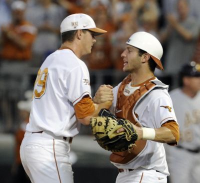 Texas reliever Corey Knebel, left, and catcher Jacob Felts celebrate the win against Arizona State in the clinching Game 3. (Associated Press)