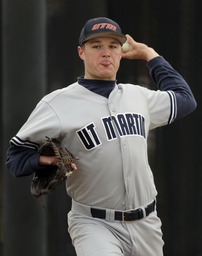 Tennessee-Martin pitcher Carter Smith holds glove with his right arm while throwing with his left. (Associated Press)