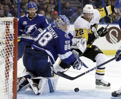 Tampa Bay Lightning goalie Andrei Vasilevskiy (88) makes a save on a shot by Pittsburgh Penguins right wing Patric Hornqvist (72) during the third period of Saturday’s game. (Chris O'Meara / Associated Press)