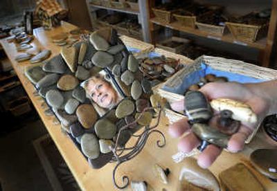 
Spokane artist Patsy Pinch holds some drawer pulls and is reflected in a small mirror she decorated Wednesday May 21, 2008. 
 (CHRISTOPHER ANDERSON / The Spokesman-Review)