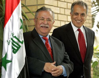 
Iraqi President Jalal Talabani, left, and US Ambassador to Iraqi Zalmay Khalilzad smile at the press Saturday. 
 (Associated Press / The Spokesman-Review)