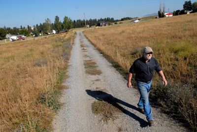 Don Hamilton’s driveway could be part of a Bigelow Gulch Road widening project. Neighbors on Orchard Prairie are banding together to protest the project.  (Brian Plonka / The Spokesman-Review)
