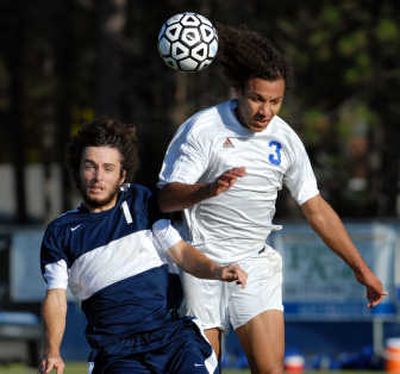 
One of four seniors anchoring Coeur d'Alene's defense is Jalon Eborall, right, who battles with Lake City's Nick Lenihan. 
 (Jesse Tinsley / The Spokesman-Review)