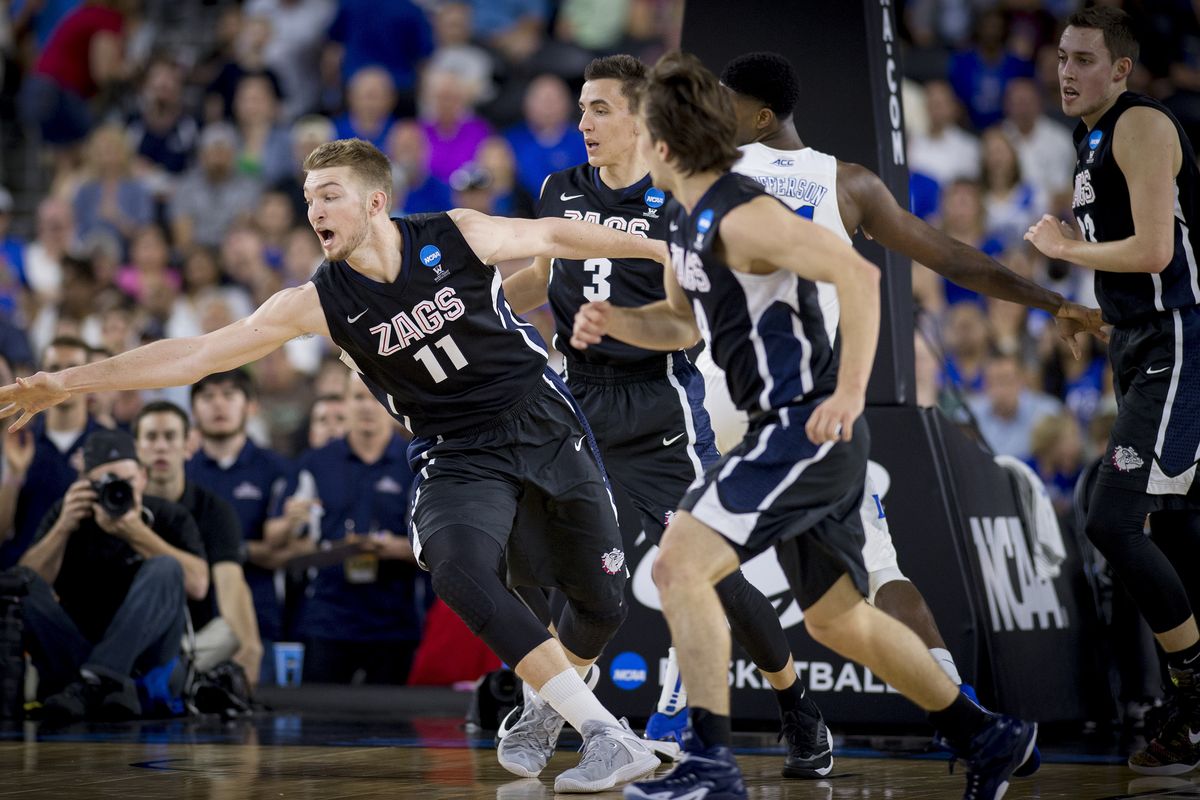 Gonzaga’s Domantas Sabonis reaches for loose ball during the first half of Sunday’s Elite Eight game in Houston. Sabonis scored seven of his nine points in the half (Colin Mulvany)