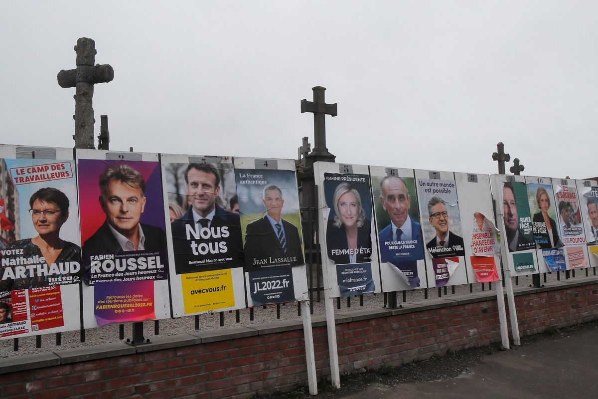 Electoral posters displaying the presidential candidates is displayed in Aubers, northern France, Friday, April 8, 2022. France