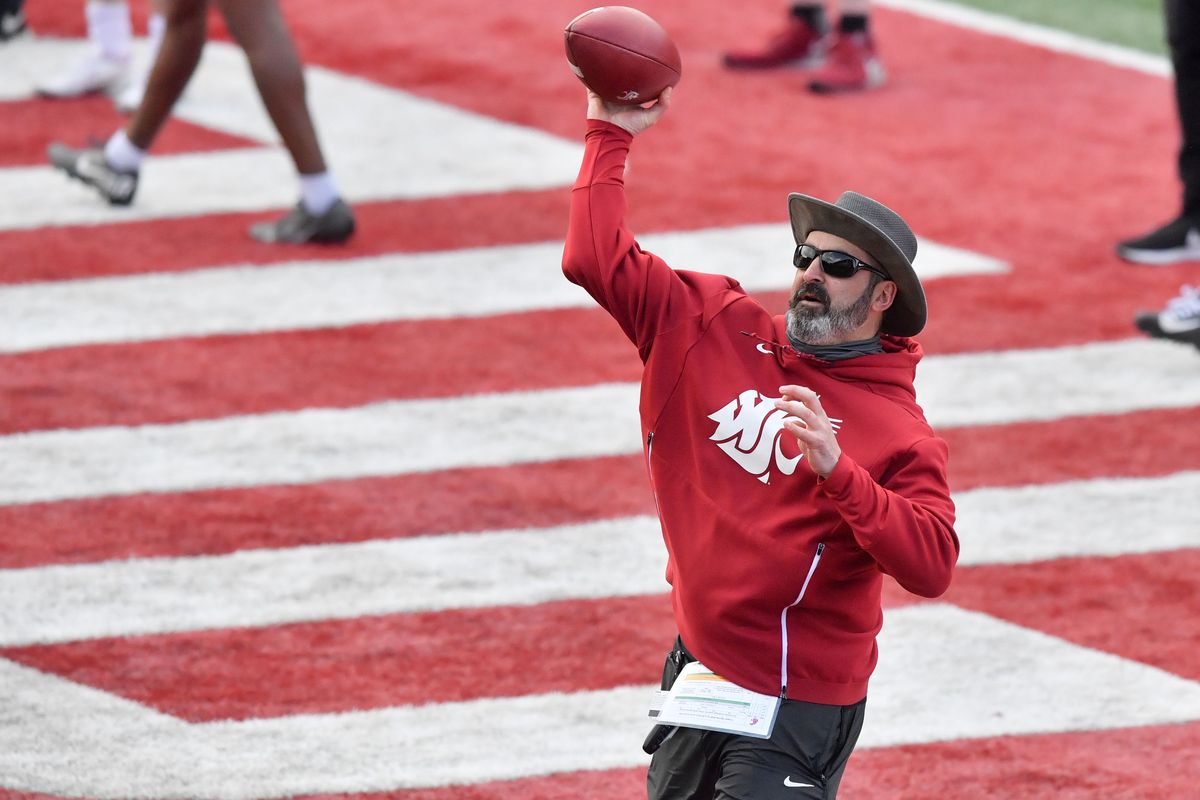 Washington State Cougars head coach Nick Rolovich throws a ball during a spring practice, April 8 on WSU’s practice field in Pullman. , Wash.  (Tyler Tjomsland / The Spokesman-Review)