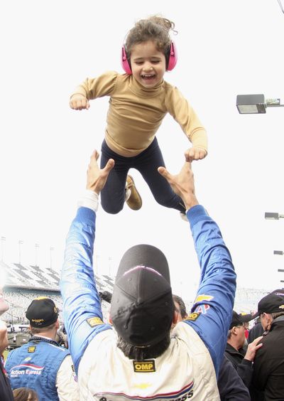 Driver Christian Fittipaldi and daughter Manuela celebrate victory at Daytona. (Associated Press)