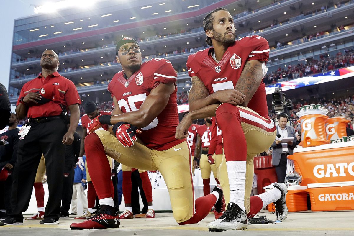 In this Monday, Sept. 12, 2016, file photo, San Francisco 49ers safety Eric Reid (35) and quarterback Colin Kaepernick (7) kneel during the national anthem before an NFL football game against the Los Angeles Rams in Santa Clara, Calif. The Panthers have signed Reid, a free agent safety, to a one-year contract. Terms of the deal were not announced Thursday. (Marcio Jose Sanchez / Associated Press)