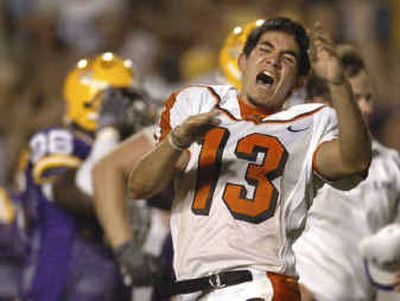 
Oregon State placekicker Alexis Serna shouts in dismay after missing a point-after kick in overtime that gave LSU a 22-21 win. He missed three extra points in the game.
 (Associated Press / The Spokesman-Review)