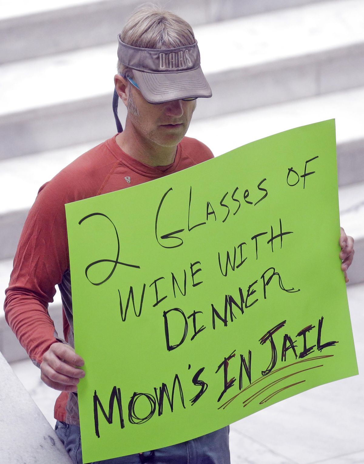 A protester holds a sign during a rally concerning the DUI threshold March 17, 2017, at the Utah State Capitol in Salt Lake City. New Year’s Eve revelers in Utah may find themselves with more than a hangover as 2019 dawns: If they drink and drive, they could get hit by the newest and lowest DUI threshold in the nation. The .05 percent limit goes into effect Dec. 30, despite protests that it will punish responsible drinkers, hurt the state’s tourism industry and amplify its alcohol-unfriendly reputation. (Rick Bowmer / AP)