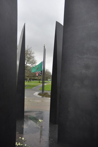 Flags at half-staff at the World War II memorial on the Washington State Capitol Campus for Pearl Harbor Day. (Jim Camden)