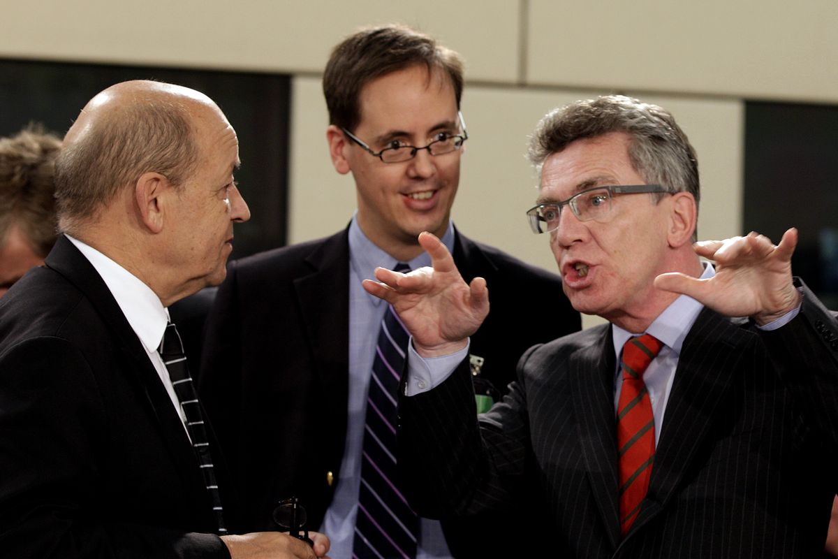 German Defense Minister Thomas de Maiziere, right, speaks with French Defense Minister Jean-Yves Le Drian, left, during a meeting of NATO Defense Ministers at NATO headquarters in Brussels on Tuesday, Oct. 9, 2012. NATO defense leaders gathering for a two-day meeting in Brussels, are committed to the war in Afghanistan, according to U.S. and alliance officials, but there are growing signs that the Afghan political and military hostilities against the coalition are starting to wear on the coalition. (Virginia Mayo / Associated Press)