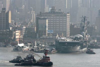 
The USS Intrepid,  stuck in the deep Hudson River mud in New York on Monday, is pulled by powerful tugboats fighting to free it and tow it across the river for a $60 million overhaul. 
 (Associated Press / The Spokesman-Review)