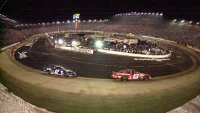 
Dale Earnhardt Jr. (8) won the Sharpie 500 at Bristol Motor Speedway Sunday, one day after winning the Busch Series Food City 250 at the same venue. 
 (Associated Press / The Spokesman-Review)