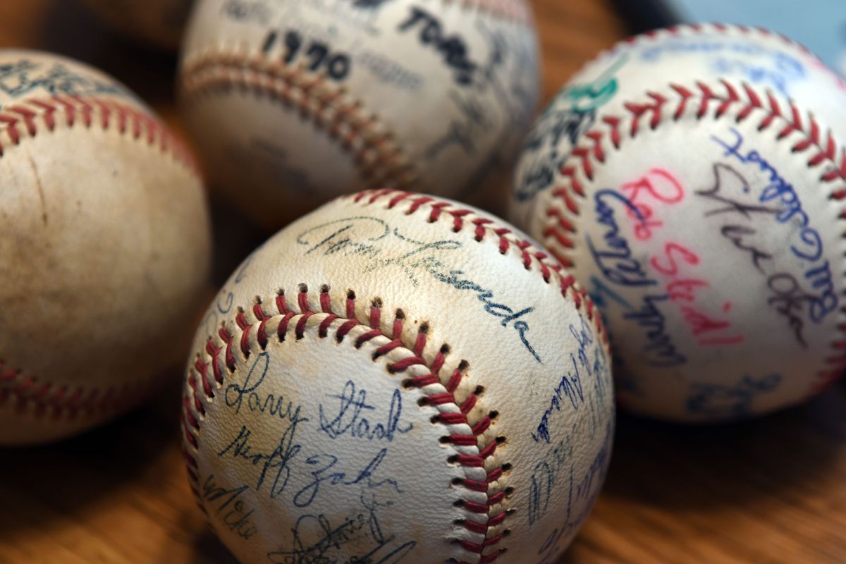 This baseball signed by Tommy Lasorda is one of Dave Vaughn’s prized possessions.  (Kathy Plonka/The Spokesman-Review)