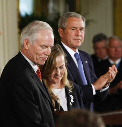 
President Bush applauds Daniel and Maureen Murphy, parents of Navy Seal Lt. Michael Murphy,  during a ceremony Monday in the White House. Associated Press
 (Associated Press / The Spokesman-Review)