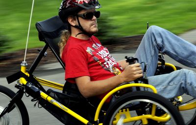 Jeff Towner, 25, rides the recumbent bicycle he received from the Idaho Commission for the Blind. Towner is legally blind with 50 percent sight in his left eye. (Kathy Plonka / The Spokesman-Review)