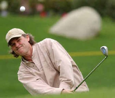 
Actor Kurt Russell chips onto the green on the 13th hole during the first round of the Bob Hope Classic in La Quinta, Calif.
 (Associated Press / The Spokesman-Review)