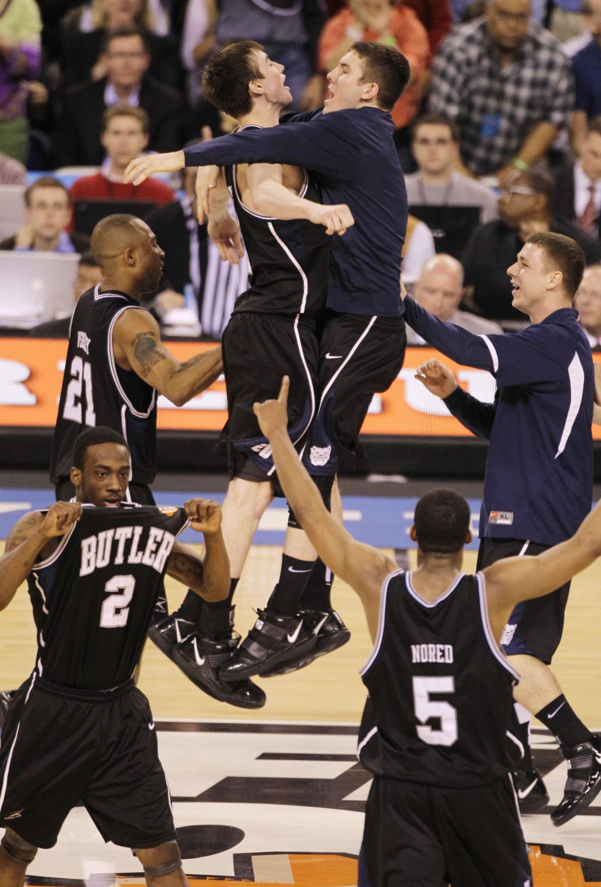 Gordon Hayward, top left, and Garrett Butcher do the Butler Bump after edging Spartans.  (Associated Press)