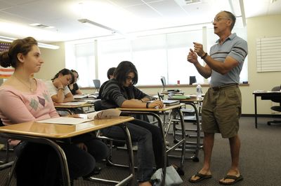 Stephen Warren, right, of West Valley High School, walks his advanced placement  biology students through an exercise Wednesday during one of two weeklong summer sessions for students to complete the required curriculum for the class.  (Jesse Tinsley / The Spokesman-Review)