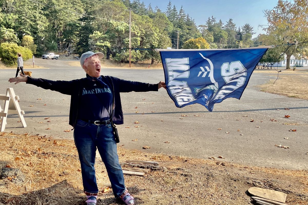 Leslie plays the role of The Tailgater as she follows a Seattle Mariners’ playoff game last fall. (John Nelson)