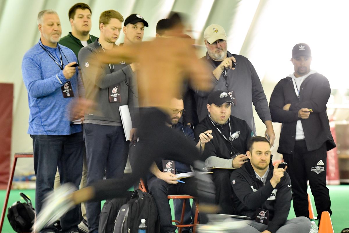 NFL scouts react as cornerback Darrien Molton runs a 40-yard dash drill during Washington State’s Pro Day on Wednesday  in Pullman. (Tyler Tjomsland / The Spokesman-Review)