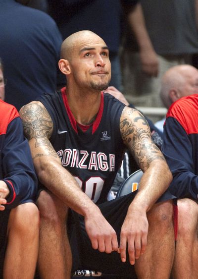 Gonzaga Robert Sacre checks the scoreboard after fouling out during the second half of Saturday's loss ot Illinois.  (Robert O'daniell / Fr57918 Ap)