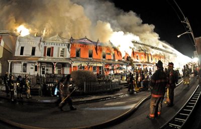 Row houses burn in Coatesville, Pa.,  late Saturday.  (Associated Press / The Spokesman-Review)