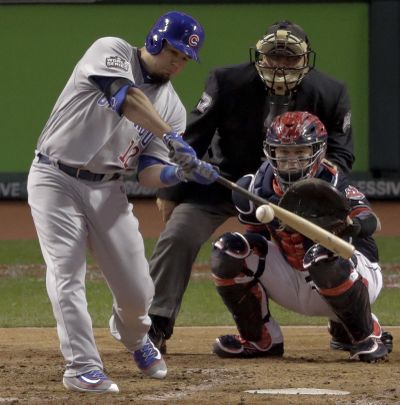 Chicago Cubs’ Kyle Schwarber hits a double against the Cleveland Indians during the fourth inning of Game 1 of the World Series. (Charlie Riedel / Associated Press)