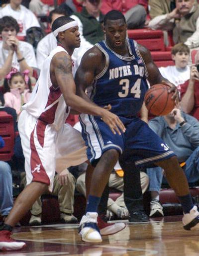 
Notre Dame's Torin Francis moves against Alabama's Chuck Davis. 
 (Associated Press / The Spokesman-Review)