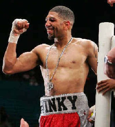 
Middleweight Winky Wright celebrates his win over Felix Trinidad that boosted him into  spotlight. 
 (Associated Press / The Spokesman-Review)