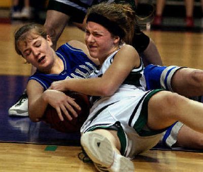 
Evergreen Lutheran's Jessica Ide (in white) battles Molly McGree of La Salle for a loose ball during a first-round game last year. 
 (File/ / The Spokesman-Review)