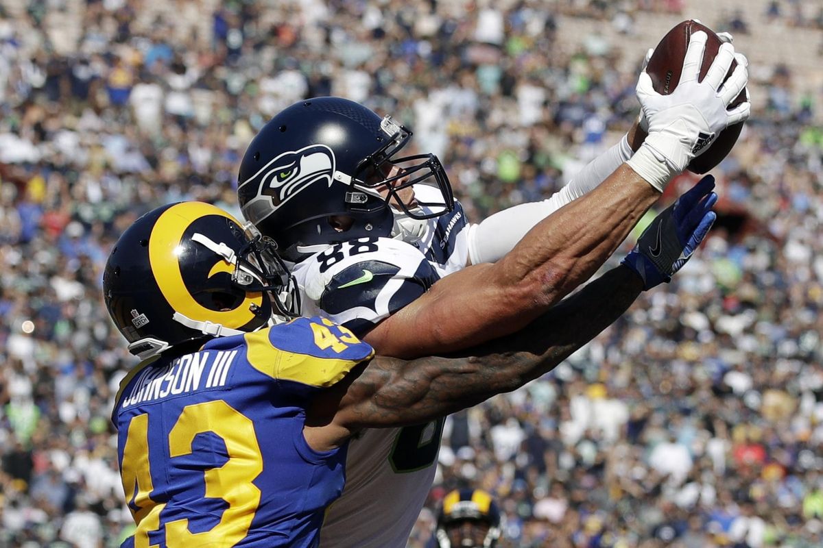 Seattle Seahawks tight end Jimmy Graham catches a touchdown pass under pressure from Los Angeles Rams defensive back John Johnson during the first half of an NFL football game Sunday, Oct. 8, 2017, in Los Angeles. It was Seattle’s only touchdown in a 16-10 victory. (Jae C. Hong / Associated Press)