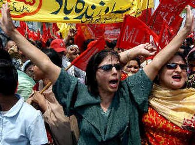 
Workers from different organizations and industries chant slogans as they march Sunday during a rally demanding improvement of conditions in their workplaces, on the occasion of Labor Day, in Lahore, Pakistan.
 (Associated Press / The Spokesman-Review)