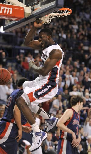 Guy Landry Edi caps off a Gonzaga victory over Saint Mary’s with a slam dunk in the final minutes. (Dan Pelle)