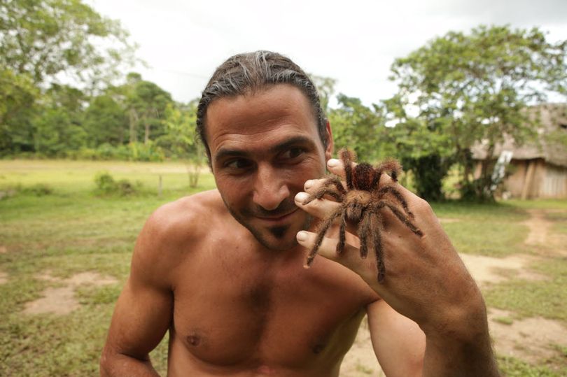Bameno, Ecuador: Hazen Audel displays his fascination with spiders, including tarantulas, in the jungle. (Jose Luis Macerola Pacha / National Geographic Channels)