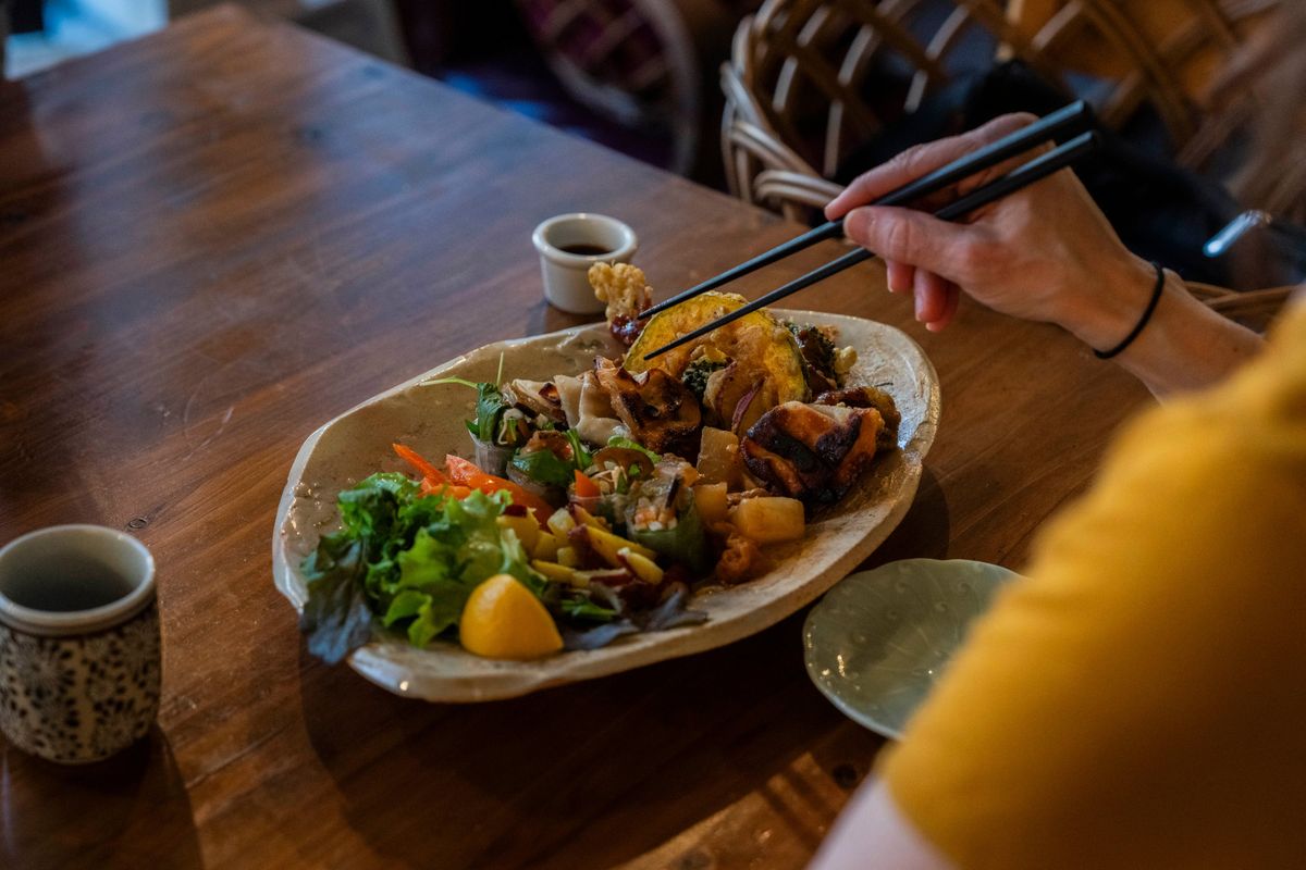 A meal at Padma, a restaurant that offers vegetarian fare along the banks of the Kamo, not far from the Imperial Palace, in Kyoto, Japan, on April 13. The Japanese city is famous for its temples and gardens, but its waterways offer a different and no less enchanting view.  (New York Times)