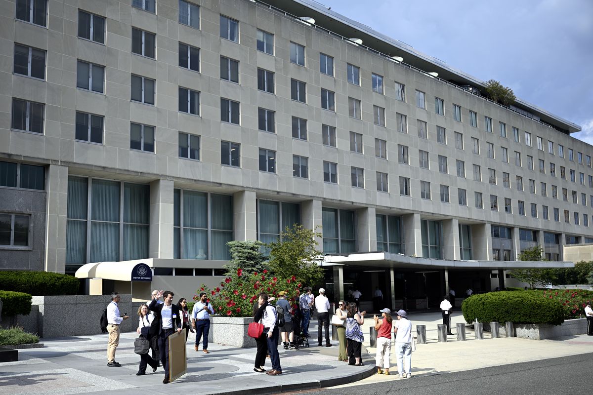 State Department employees are greeted by supporters cheering as they leave their office on July 11, the day of mass layoffs at the agency. MUST CREDIT: Marvin Joseph/The Washington Post  (Marvin Joseph/The Washington Post)