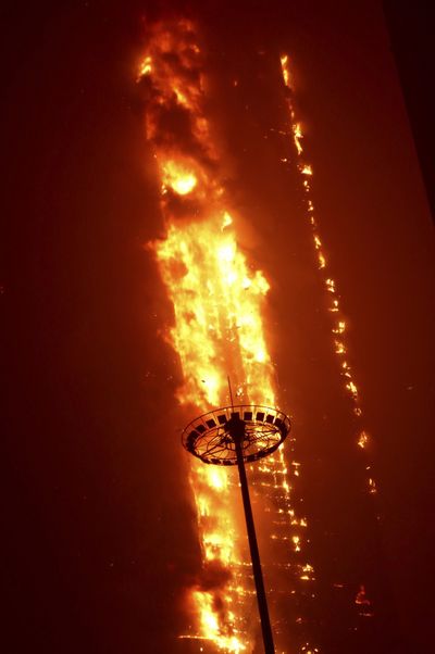 Fire devours an entire block of the Dynasty Wanxin Hotel in Shenyang in northeast China on Thursday. (Associated Press)