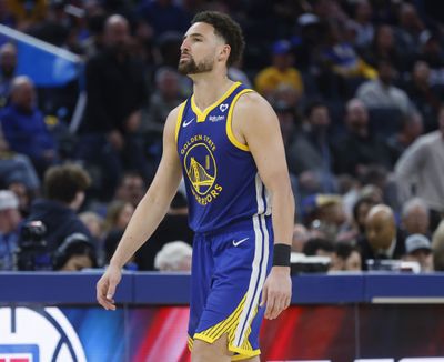 Golden State’s Klay Thompson heads to the bench during a timeout in a Feb. 25 game against the Denver Nuggets at the Chase Center in San Francisco.  (Tribune News Service)
