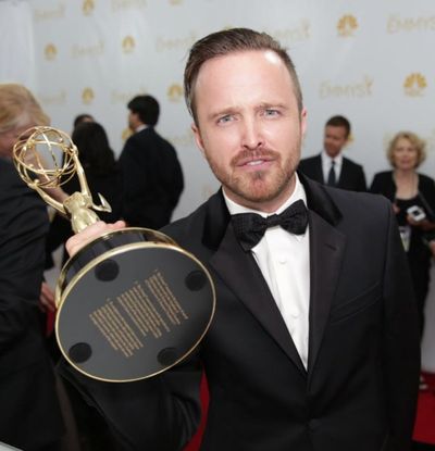 'Breaking Bad' star Aaron Paul poses with the the award for outstanding supporting actor in a drama series for his work on “Breaking Bad” at the 2014 Emmy Awards at the Nokia Theatre in Los Angeles. (Photo by Casey Curry/Invision for the Television Academy/AP Images)