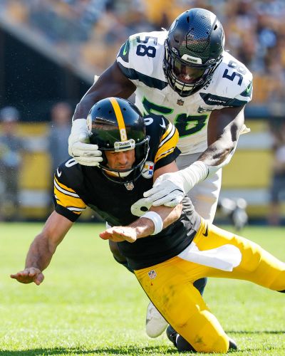 Seahawks linebacker Derick Hall sacks Steelers quarterback Aaron Rodgers during a 2025 game at Acrisure Stadium in Pittsburgh.   (Jennifer Buchanan/Seattle Times)