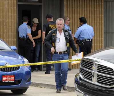 A Houston narcotics officer leaves the Houston clinic operated by Dr. Conrad Murray, who was pop star Michael Jackson’s personal physician.  (Associated Press / The Spokesman-Review)