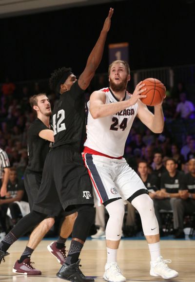 Przemek Karnowski drives against Texas A&M's Tavario Millerin the semifinals of the Battle 4 Atlantis tournament on Thursday. (Logan Reidsma / Special to The Spokesman-Review)