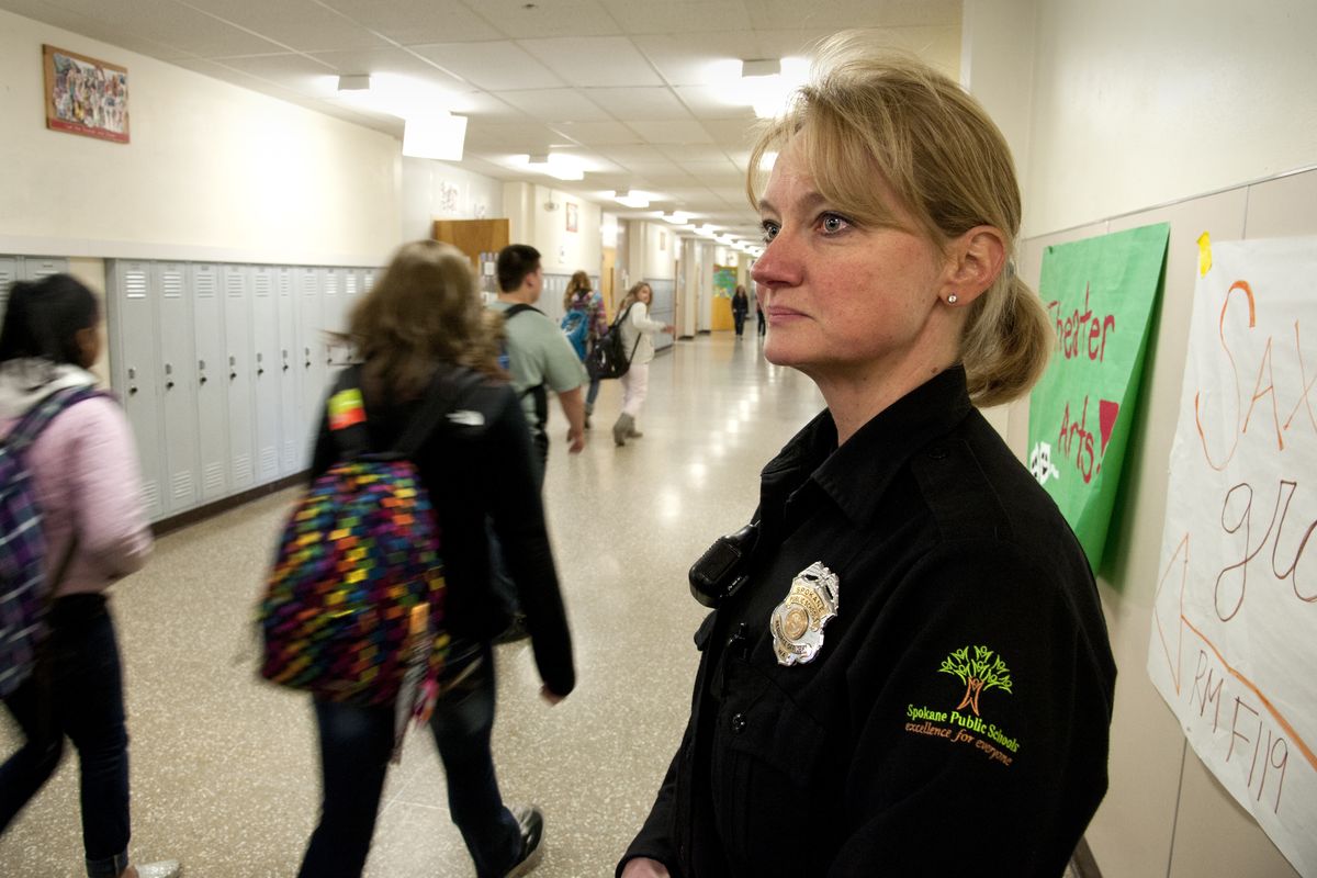 Spokane Public Schools resource officer Becky Wilkey has a visible presence at Ferris High School during the noon hour on Thursday. (Dan Pelle)
