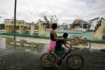 Youths survey the destruction after Hurricane Dean passed through Limones, Mexico, on Tuesday. Associated Press
(Associated Press / The Spokesman-Review)
