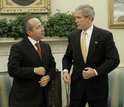 
President Bush, right, meets with Mexico's President-elect Felipe Calderon in the Oval Office of the White House in Washington, D.C., on Thursday. 
 (Associated Press / The Spokesman-Review)