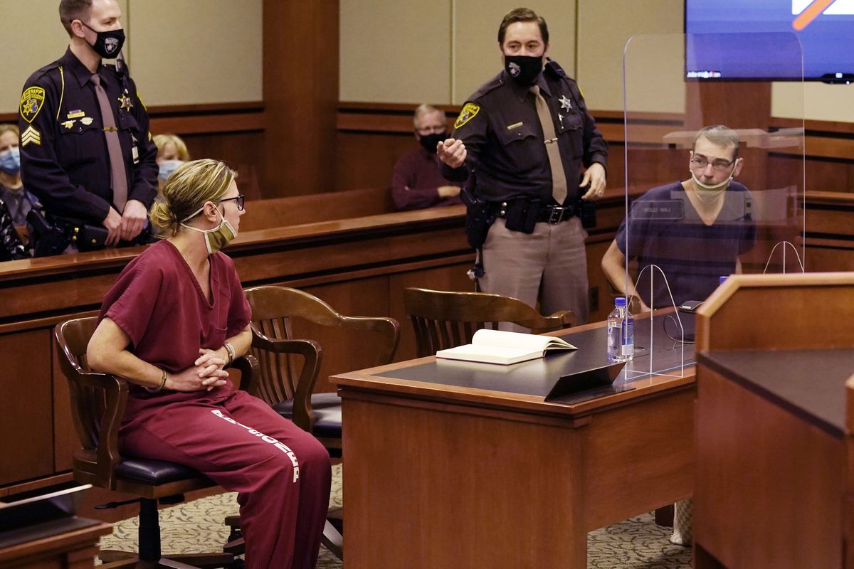 James Crumbley, right, looks towards his wife Jennifer Crumbley during a court hearing in Rochester Hills, Mich., Dec. 14, 2021. School systems nationwide rely on high-level expertise from the U.S. Secret Service and others as they work to stay vigilant for signs of potential student violence, training staff, surveilling social media and urging others to tip them off. However, when it comes to deciding how to respond to a possible threat, it’s the local educators who make the call.  (Carlos Osorio)