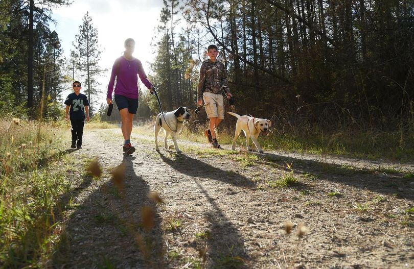 The Clark family ends many of their days with a hike through the lush forest and craggy hills west of Mica Peak. (The Spokesman-Review)