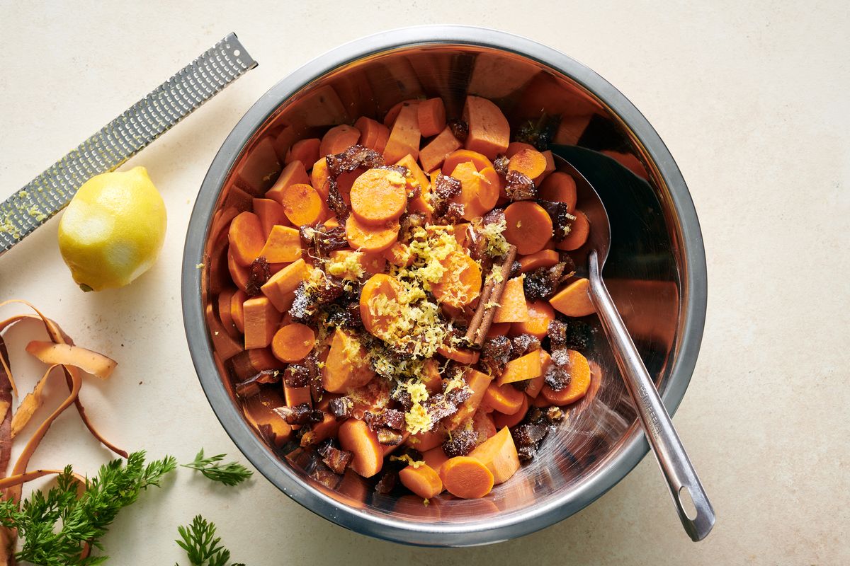 Braised chicken thighs with sweet potatoes and dates. This recipe, inspired by tsimmes, keeps ease in mind, turning a simple side dish into a main. Food styled by Simon Andrews.   (DAVID MALOSH/New York Times)